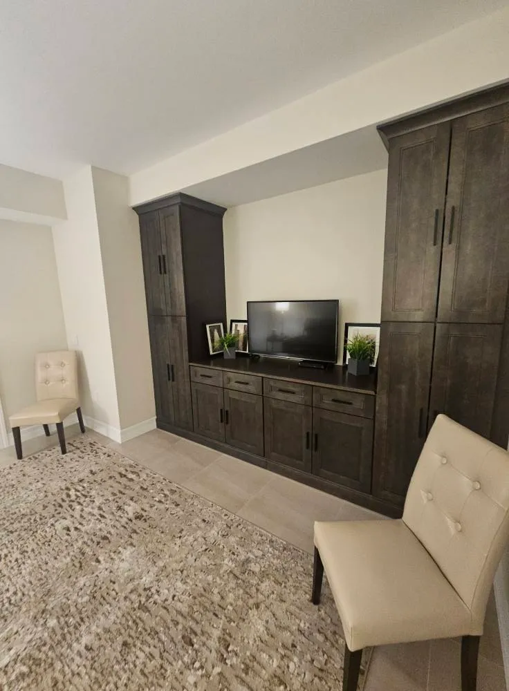 Custom entertainment wall and built-in carpentry in Marco Island FL for luxury home cinema setup
